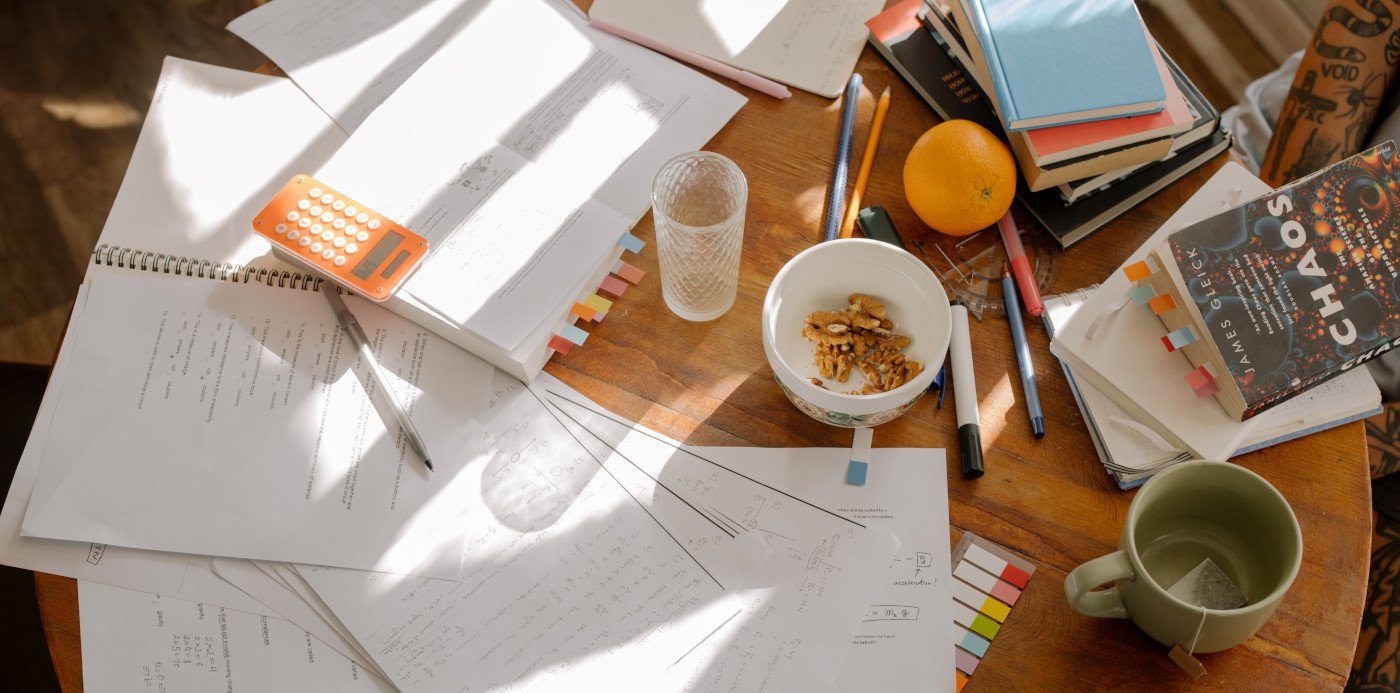 A bunch of papers spread out on a table