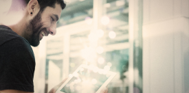 Smiling boy with a tablet in his hands